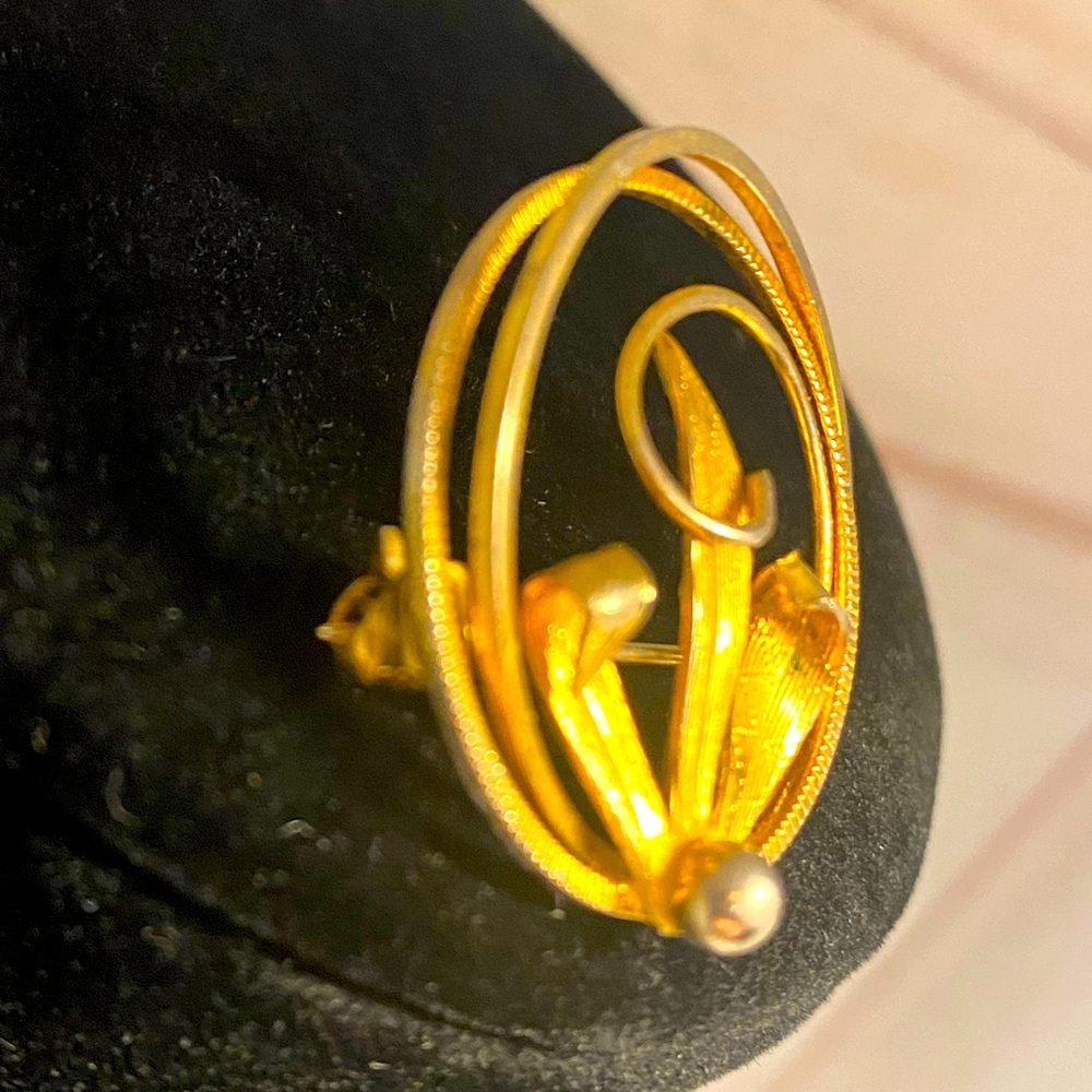 gold tone brooch